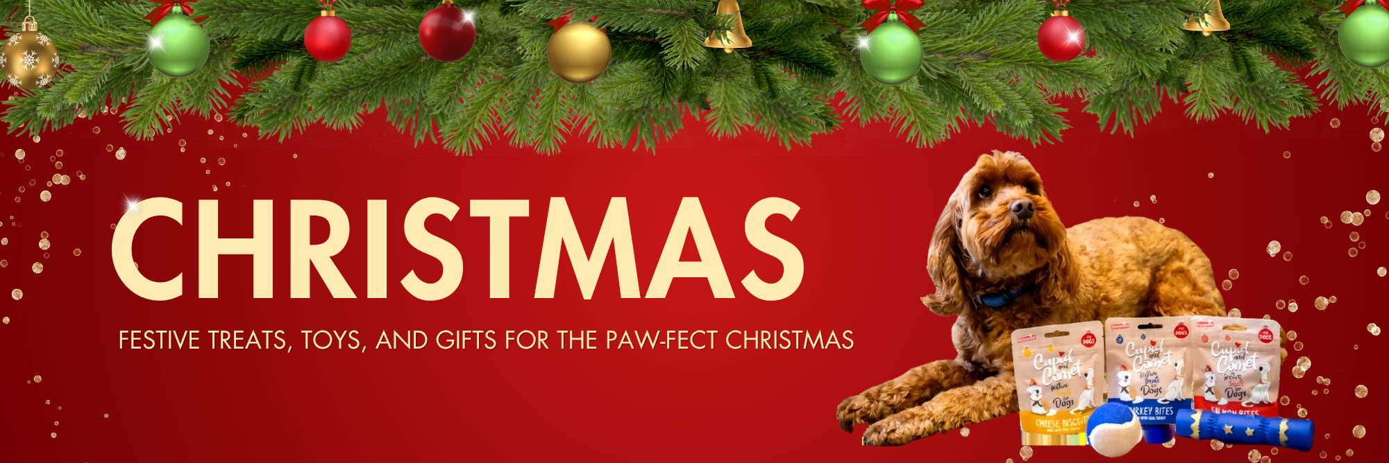 Christmas banner with festive decorations, green pine branches and baubles, a brown dog lying beside dog treats and toys, and text that reads ‘Christmas – Festive treats, toys, and gifts for the paw-fect Christmas’